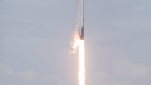 A Falcon 9 rocket ascending through the sky