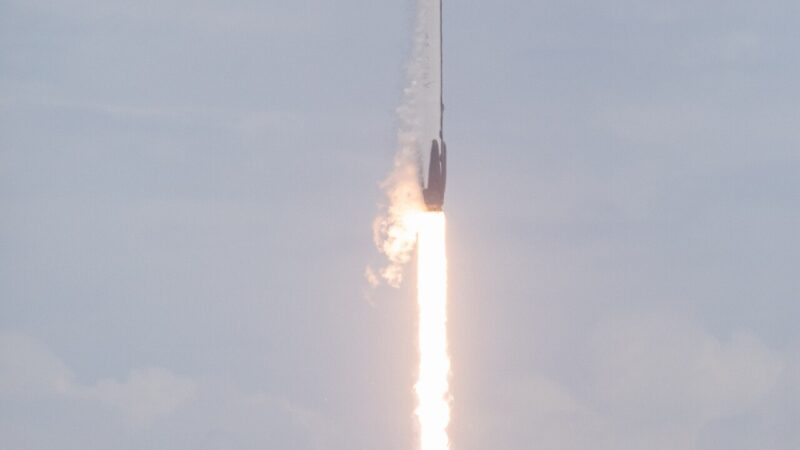 A Falcon 9 rocket ascending through the sky
