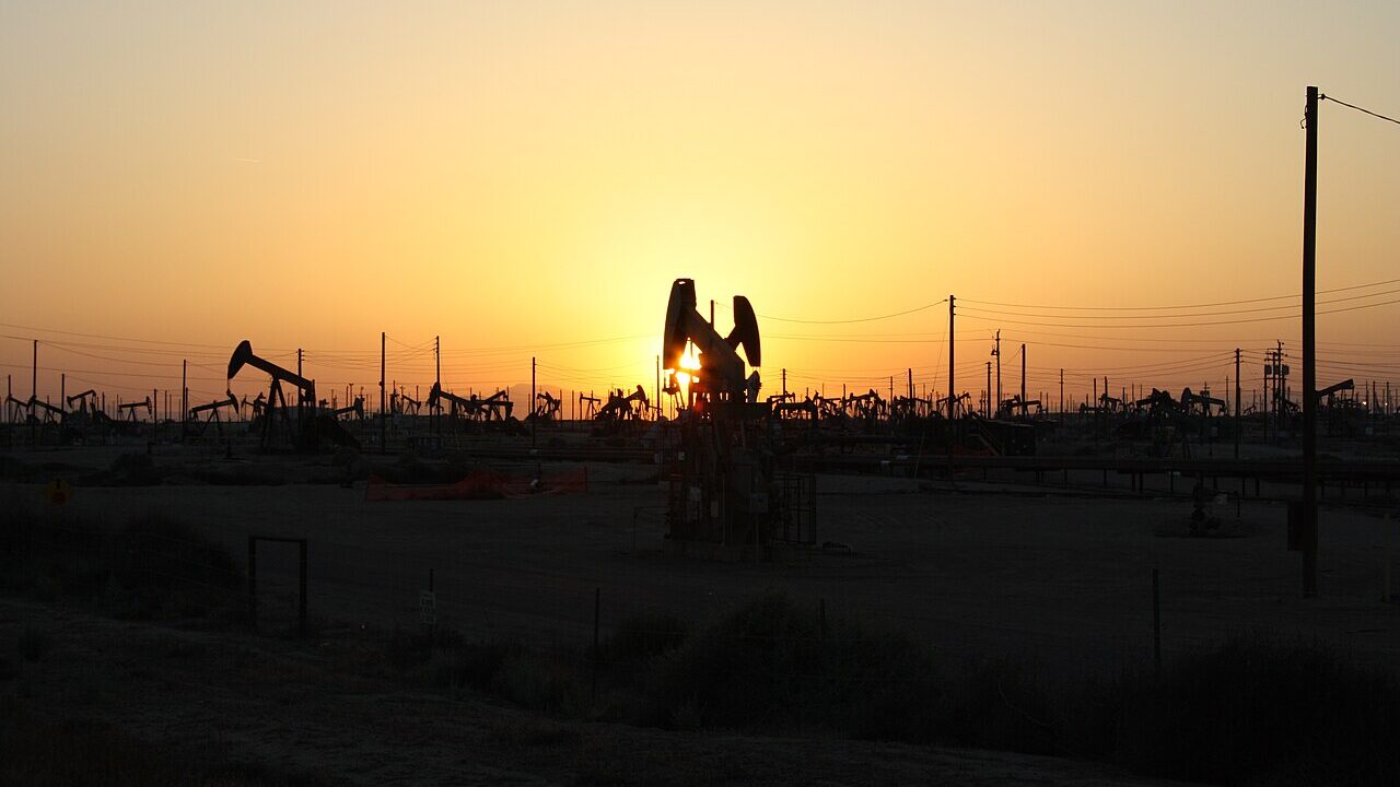 Oil pumpjacks silhouetted against the sunset