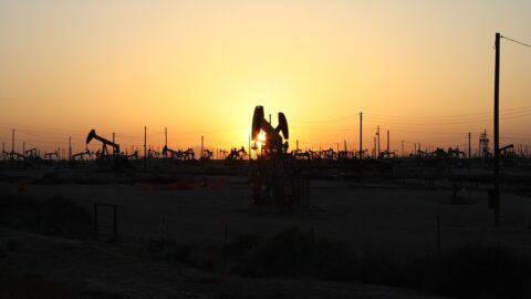 Oil pumpjacks silhouetted against the sunset
