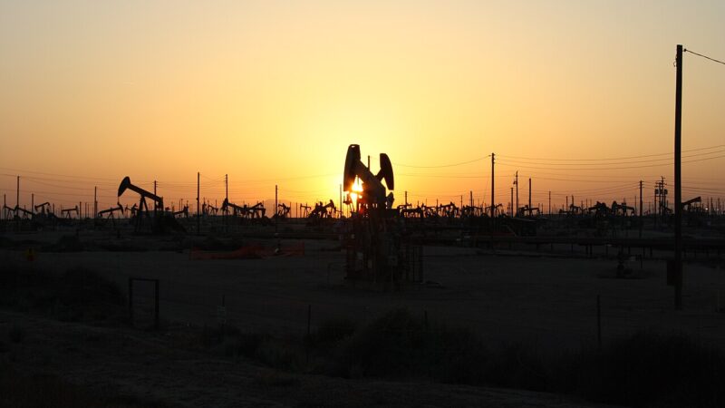 Oil pumpjacks silhouetted against the sunset