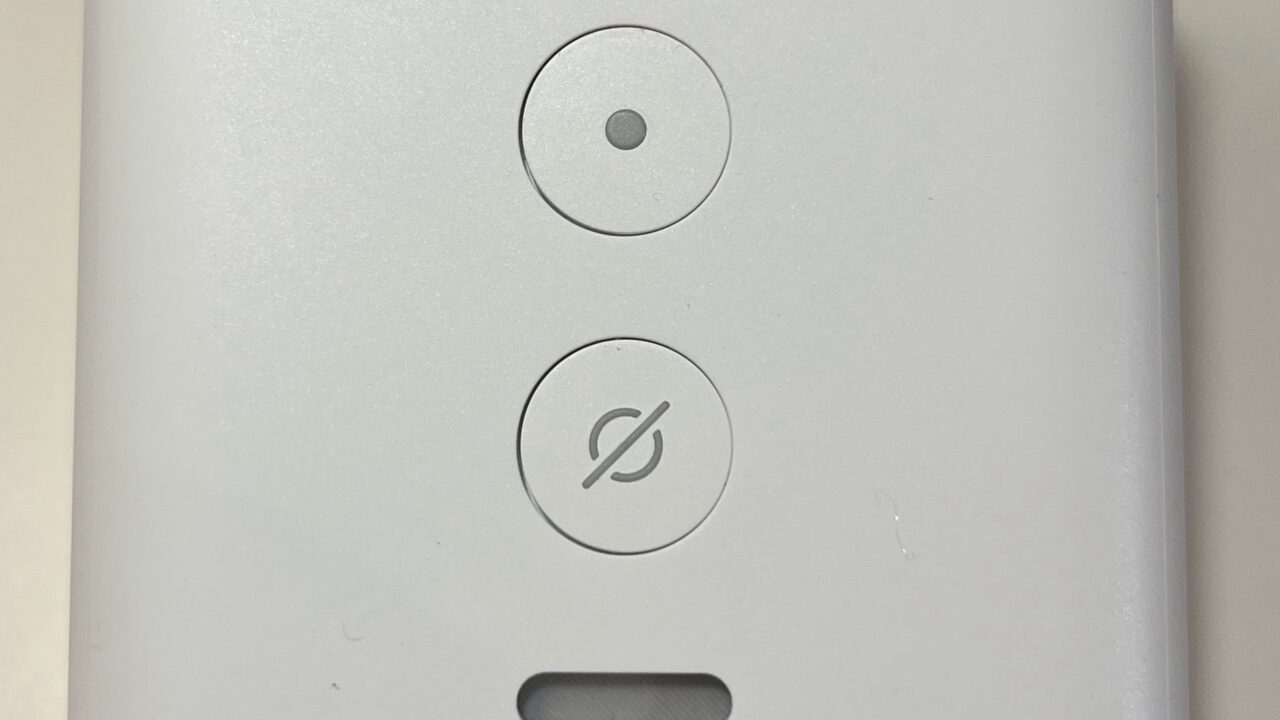 White Amazon Echo Flex smart speaker on a plain background