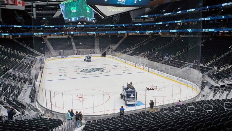 Ice hockey rink inside Seattle's Climate Pledge Arena with the Kraken logo at centre ice