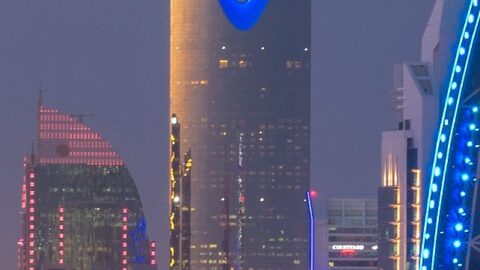 The Riyadh skyline at dusk with the Kingdom Centre tower