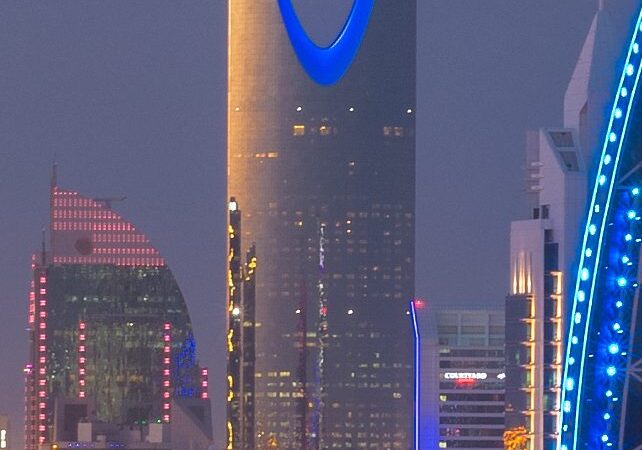The Riyadh skyline at dusk with the Kingdom Centre tower