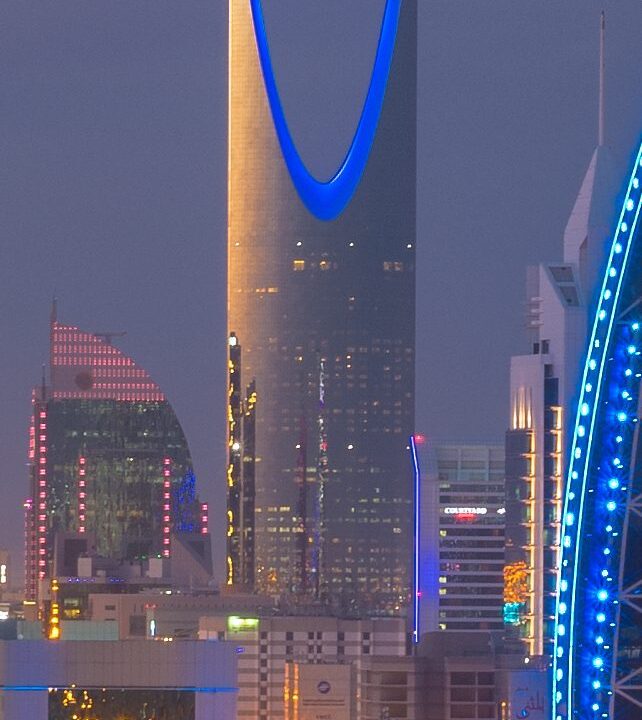 The Riyadh skyline at dusk with the Kingdom Centre tower